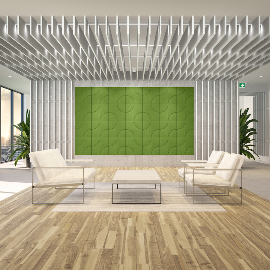 Image of a room with green Acoustek acoustic tiles on the wall and acoustic blades hanging from the ceiling and wall.