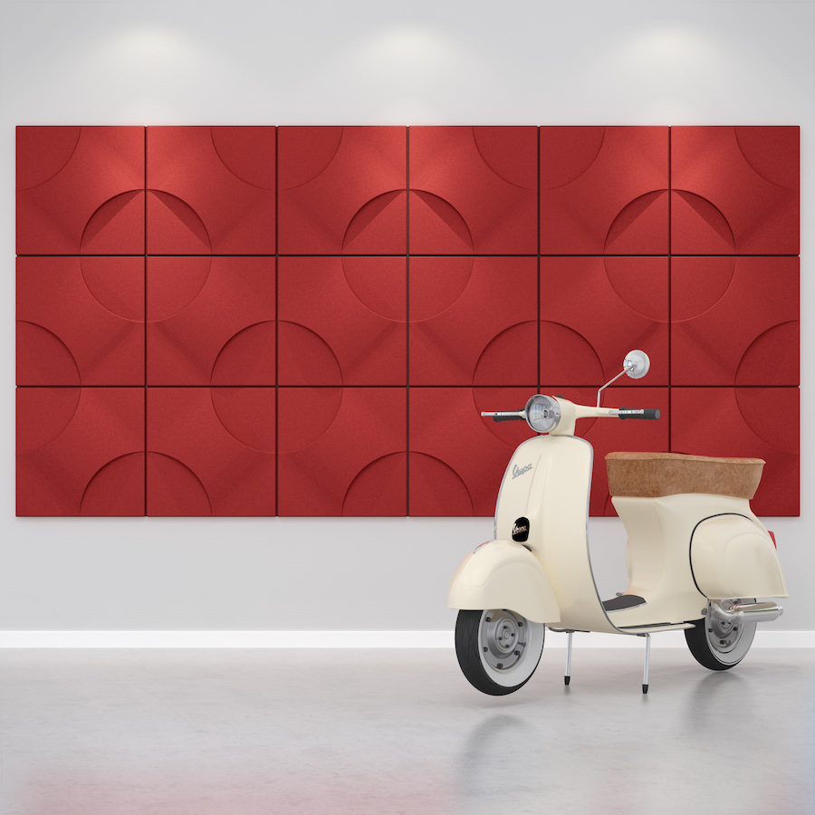 Image of red Celano acoustic tiles on a wall behind a white scooter. Acoustic tiles from Acoustek's Cavassini collection - manufactured & available to buy from Acoustek Australia & UK.