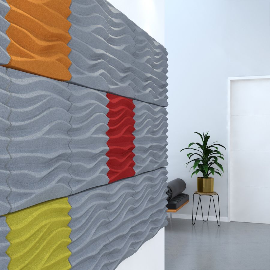 Image of grey, orange, red & yellow Sand acoustic tiles with rippled effect attached to a wall. Acoustic tiles from Acoustek's Newport collection, manufactured & sold by Acoustek Australia & UK.