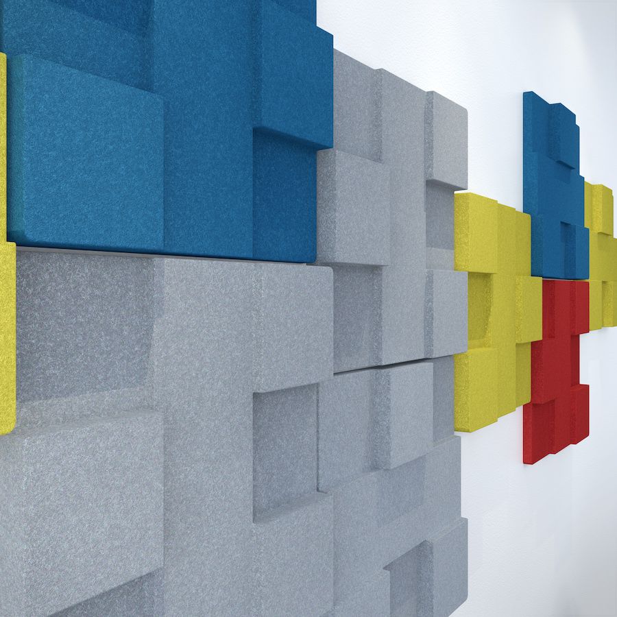 Image of yellow, blue, grey & red Urban acoustic tiles attached to wall in a room. Acoustic tiles part of Acoustek's Newport range and inspired by American design & coastal living. Sold & manufactured by Acoustek Australia & UK.