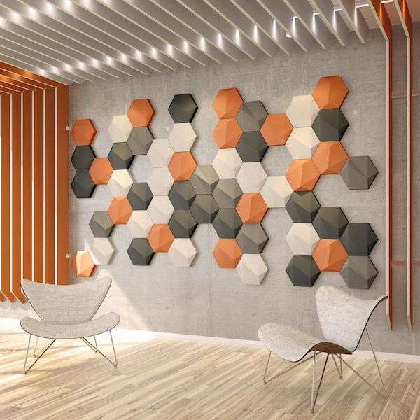 Photo of Acoustek acoustic tiles from the Porto collection - these are in various colours (orange, black, grey, white).